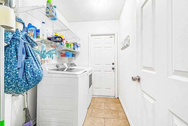 3105 Quebec Dr, Corpus Christi, TX 78414 - clothes washing area with washing machine and dryer, baseboards, and light tile patterned flooring