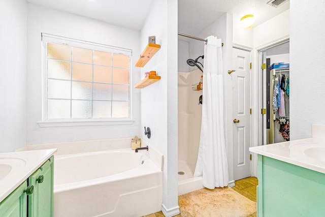 3105 Quebec Dr, Corpus Christi, TX 78414 - bathroom with vanity, a stall shower, and a bath