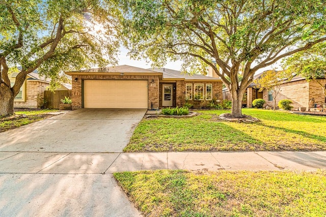 3105 Quebec Dr, Corpus Christi, TX 78414 - ranch-style house featuring a garage, driveway, and brick siding