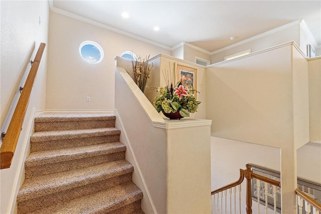 staircase featuring baseboards, ornamental molding, and recessed lighting