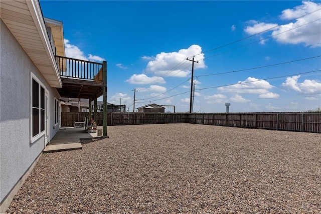 view of yard featuring a patio area and a fenced backyard