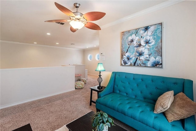 carpeted living area with baseboards, recessed lighting, crown molding, visible vents, and ceiling fan