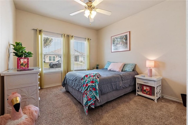 bedroom with baseboards, a ceiling fan, and carpet floors