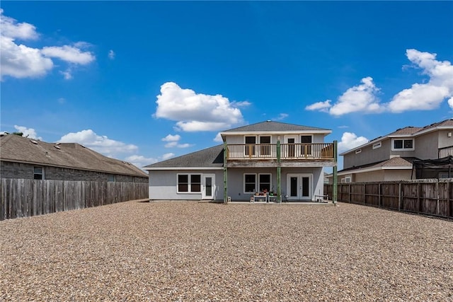 back of house with a patio, french doors, and a fenced backyard