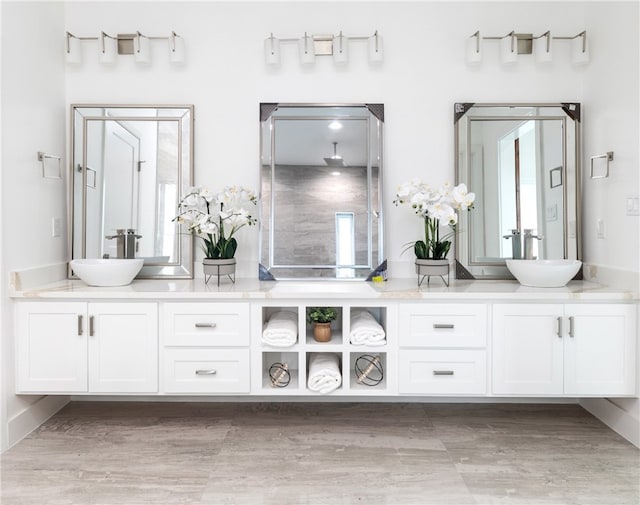 13974 Blackbeard Dr, Corpus Christi, TX 78418 - bathroom featuring double vanity and wood finished floors