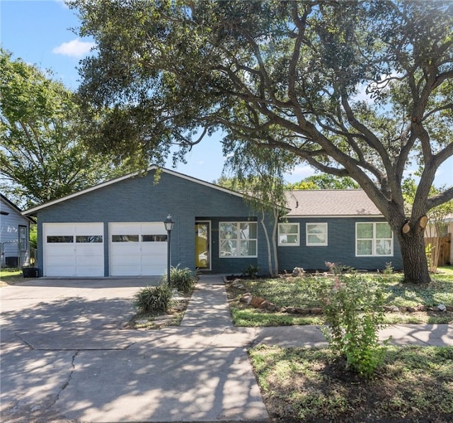 single story home with a garage