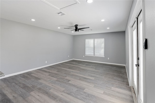 empty room featuring light wood-type flooring and ceiling fan