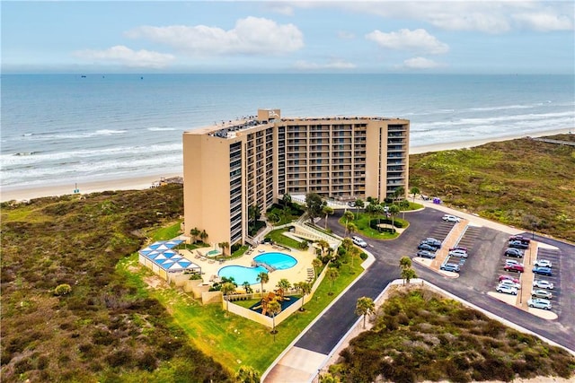 aerial view featuring a water view and a beach view