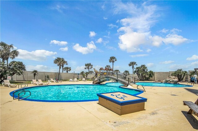 view of swimming pool with a patio