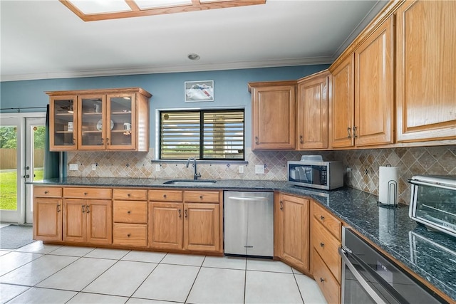 6041 King Trl, Corpus Christi, TX 78414 - kitchen featuring appliances with stainless steel finishes, a sink, backsplash, light tile patterned floors, and crown molding