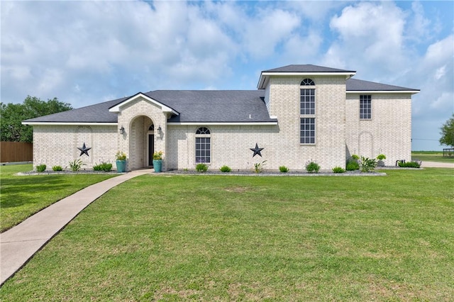 6041 King Trl, Corpus Christi, TX 78414 - view of front facade with brick siding and a front yard