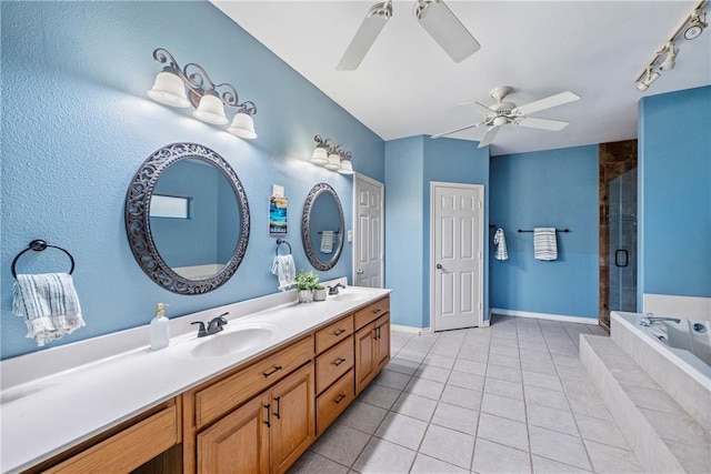 6041 King Trl, Corpus Christi, TX 78414 - bathroom featuring ceiling fan, double vanity, a garden tub, a stall shower, and tile patterned flooring