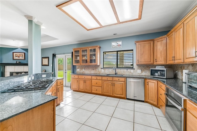6041 King Trl, Corpus Christi, TX 78414 - kitchen with appliances with stainless steel finishes, a sink, tasteful backsplash, light tile patterned floors, and crown molding