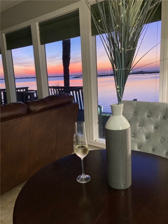 dining space featuring a water view