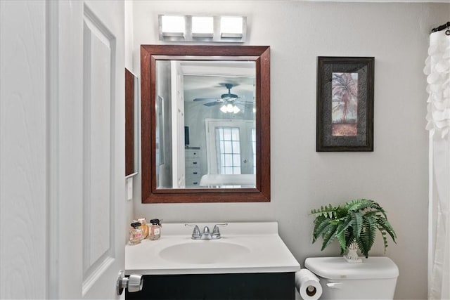 bathroom with toilet and vanity