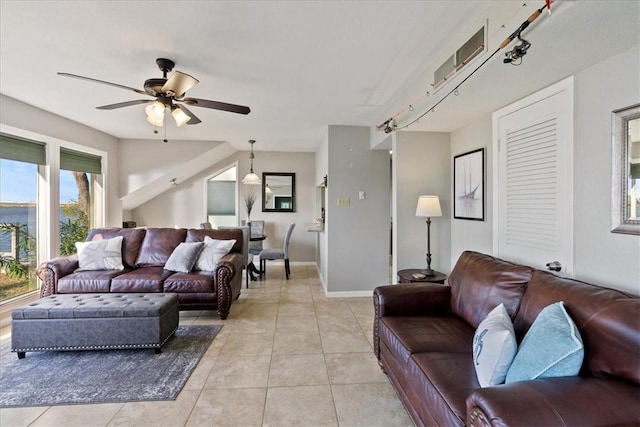 living room with ceiling fan and light tile patterned floors