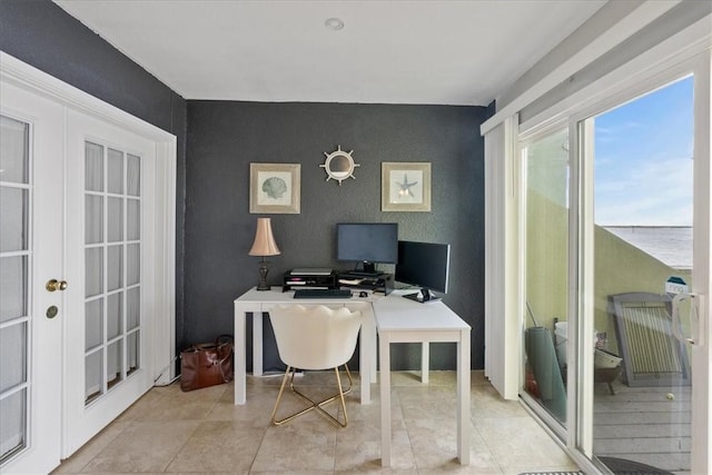 office with french doors and light tile patterned flooring