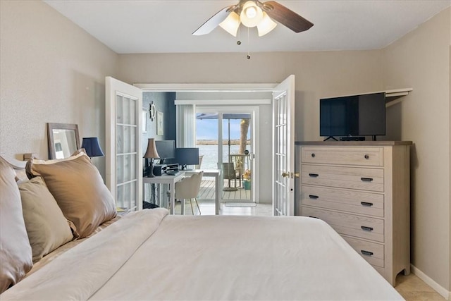 bedroom with light tile patterned flooring, ceiling fan, and access to exterior