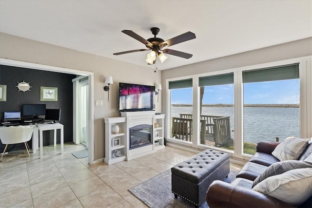 tiled living room with ceiling fan