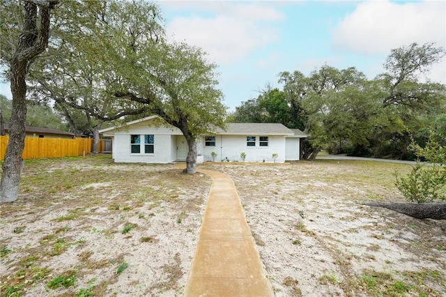 rear view of property with fence