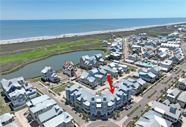 drone / aerial view with a view of the beach and a water view