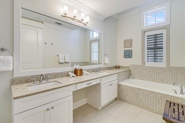 bathroom featuring tiled bath, tile patterned floors, vanity, and crown molding