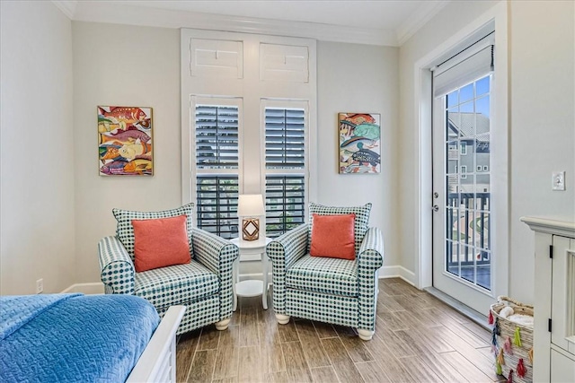 sitting room featuring crown molding