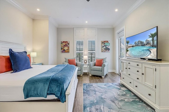 bedroom featuring crown molding and light hardwood / wood-style floors