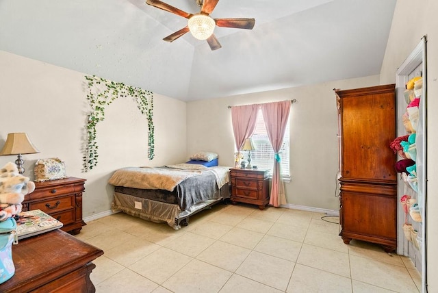 7418 Oshman Dr, Corpus Christi, TX 78414 - bedroom with vaulted ceiling, baseboards, light tile patterned flooring, and a ceiling fan