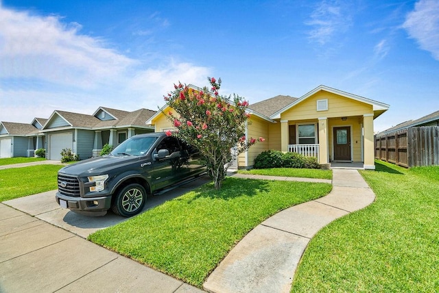 7418 Oshman Dr, Corpus Christi, TX 78414 - view of front of home featuring concrete driveway, covered porch, and an attached garage