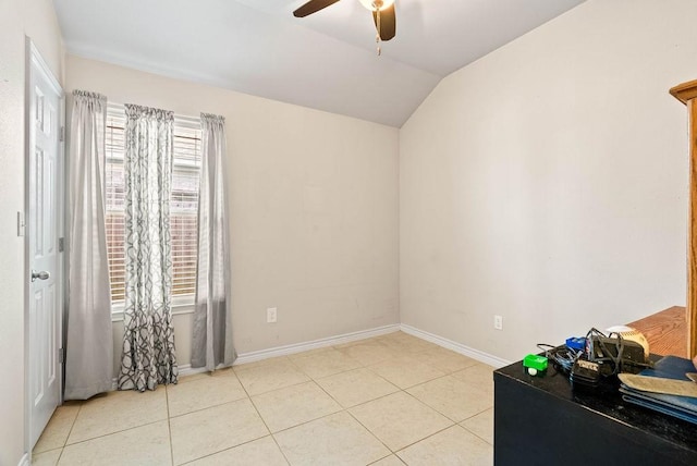 7418 Oshman Dr, Corpus Christi, TX 78414 - empty room with ceiling fan, vaulted ceiling, light tile patterned floors, and baseboards