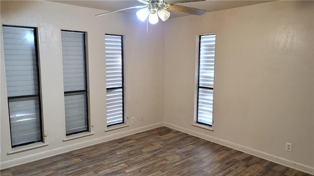 spare room featuring dark hardwood / wood-style floors, plenty of natural light, and ceiling fan