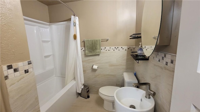 bathroom featuring shower / bath combination with curtain, toilet, and tile walls