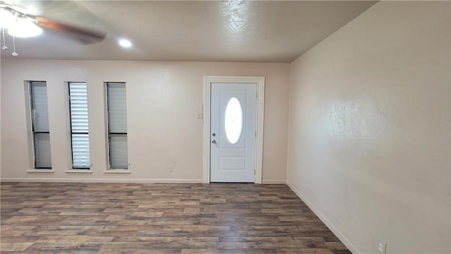 foyer with dark hardwood / wood-style flooring and ceiling fan