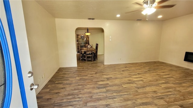 unfurnished room with ceiling fan and hardwood / wood-style flooring