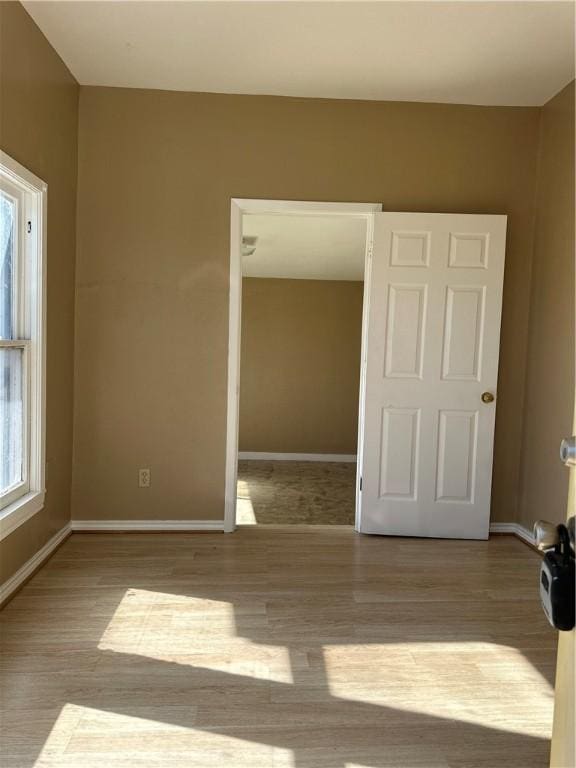 spare room with light hardwood / wood-style floors