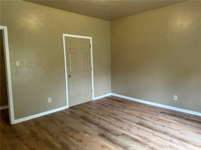 unfurnished room with light hardwood / wood-style flooring