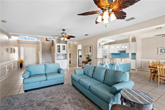 14106 Palo Seco Dr, Corpus Christi, TX 78418 - living area with light tile patterned floors, ornamental molding, and ceiling fan
