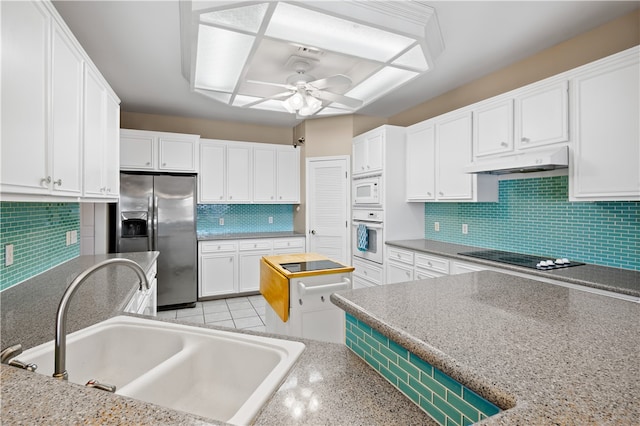 14106 Palo Seco Dr, Corpus Christi, TX 78418 - kitchen with a sink, backsplash, white appliances, ceiling fan, and under cabinet range hood