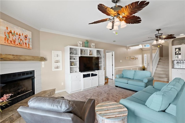 14106 Palo Seco Dr, Corpus Christi, TX 78418 - living room with a ceiling fan, a fireplace with raised hearth, ornamental molding, and light tile patterned flooring