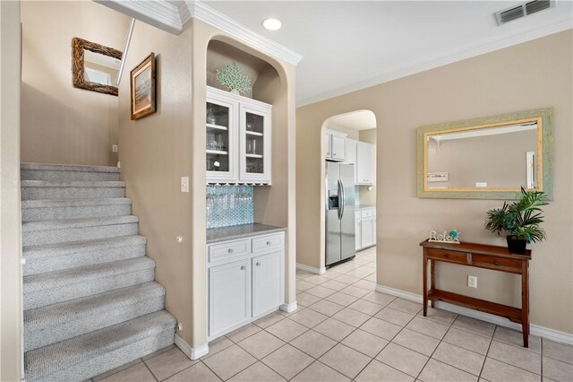 14106 Palo Seco Dr, Corpus Christi, TX 78418 - stairway featuring arched walkways, tile patterned flooring, visible vents, and baseboards