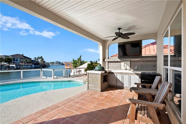 14106 Palo Seco Dr, Corpus Christi, TX 78418 - outdoor pool with a patio area, a ceiling fan, exterior kitchen, and a sink