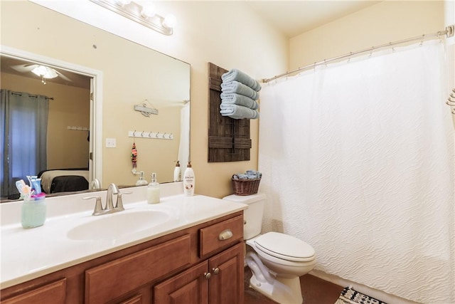 bathroom featuring toilet and vanity