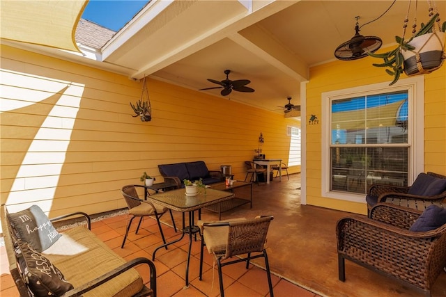 view of patio with outdoor dining space, an outdoor living space, and a ceiling fan