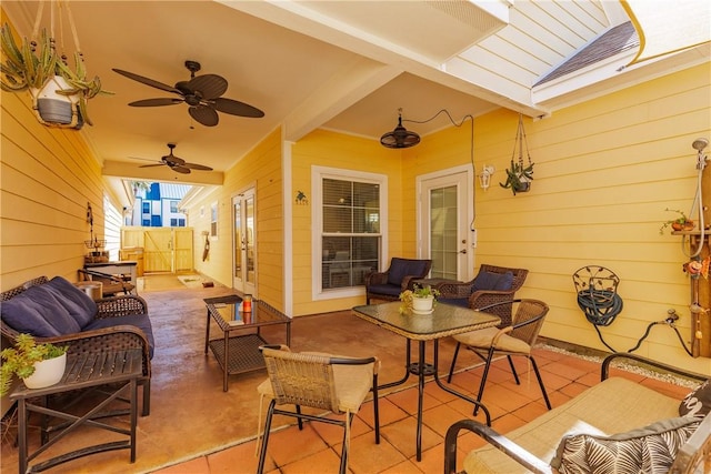 view of patio / terrace featuring a gate, outdoor lounge area, and a ceiling fan