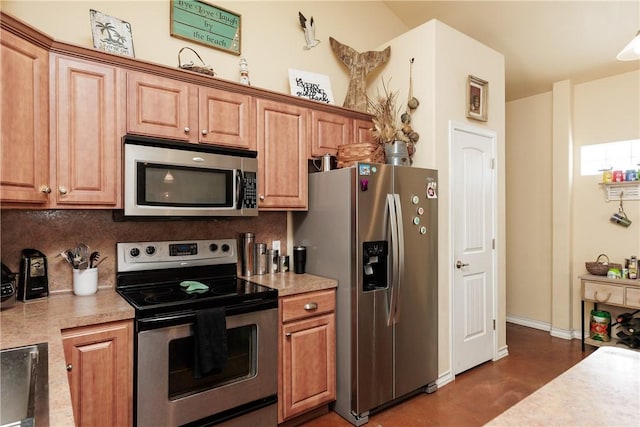 kitchen with stainless steel appliances, tasteful backsplash, light countertops, and brown cabinets