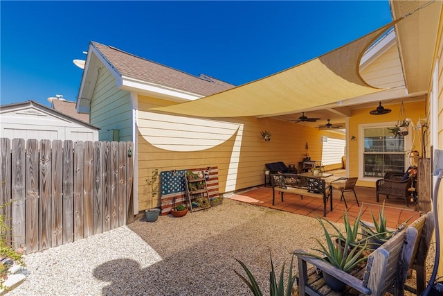 view of patio / terrace featuring ceiling fan and fence