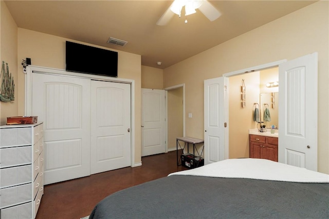 bedroom featuring ceiling fan, a closet, ensuite bath, and visible vents