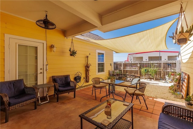 view of patio / terrace featuring outdoor dining space and fence