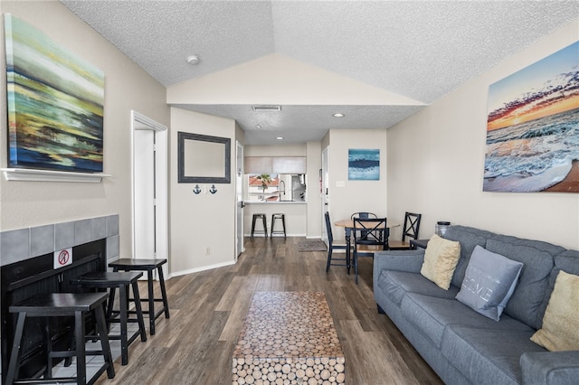 14721 Whitecap Blvd Unit 344, Corpus Christi, TX 78418 - living area with dark wood finished floors, lofted ceiling, and a textured ceiling